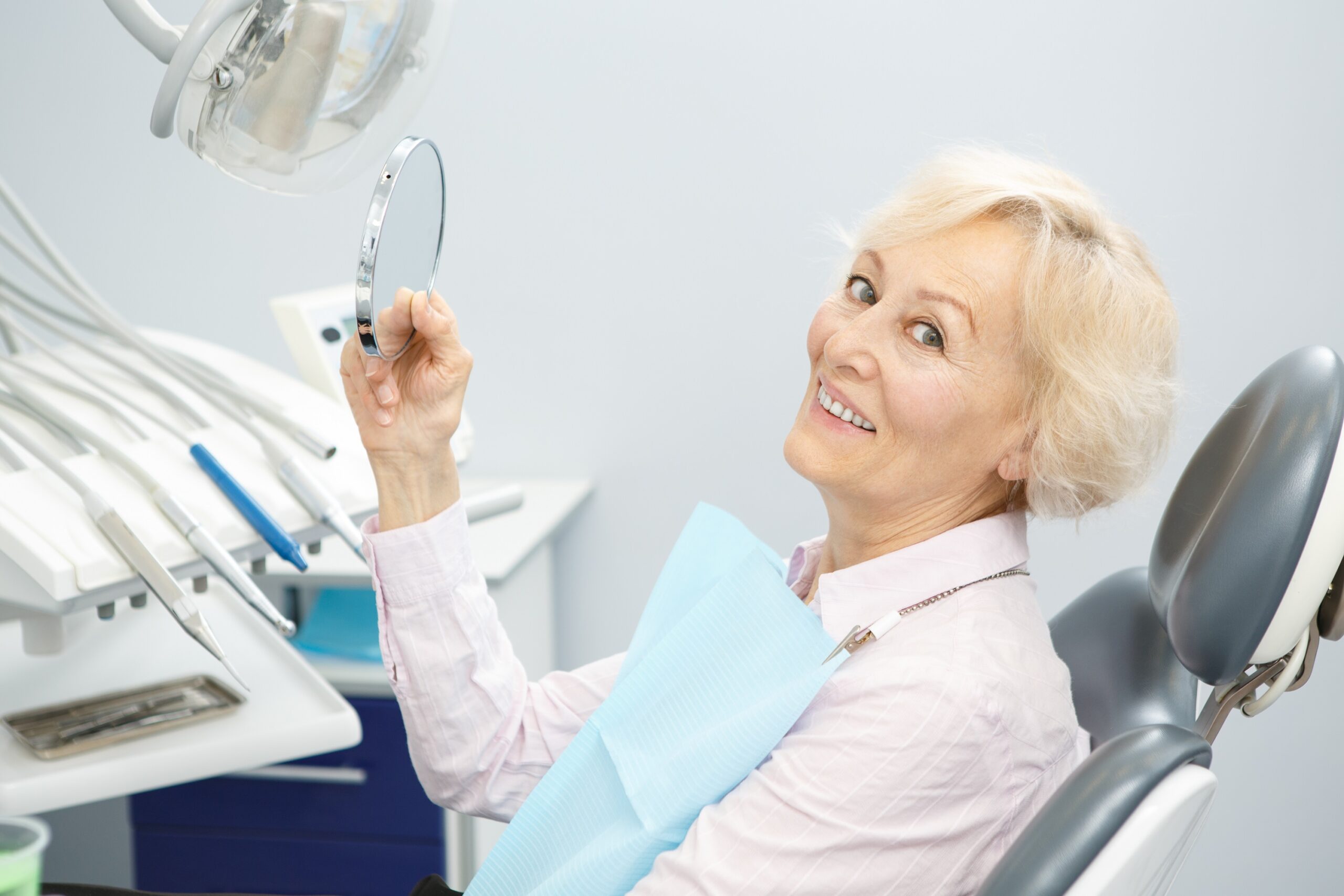 An image of a woman who received dental implants.